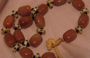 Caramel and licorice necklace with horse head clasp